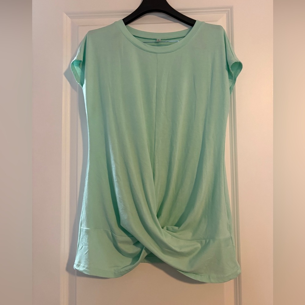 Ladies size S twist front short sleeve top.  Washed never worn. Light turquoise